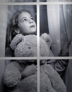 How to spot a child molester, picture of little girl looking out a window