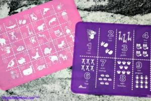 The placemats are colorful, fun and stick to the table from Brinware. ad