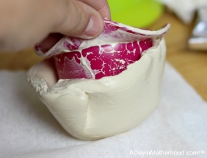 Help kids remove the silicone sleeve when they make pottery at home.