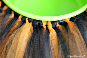 Bunch the tulle together to create a No Sew Halloween Basket!