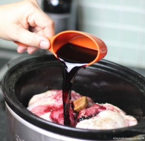 Add wine for flavor to your Slow Cooker Wild Rice Stuffed Cornish Game Hen Recipe