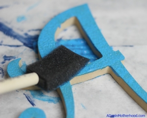 Painted letters help with the decor for celebrating doing well in school