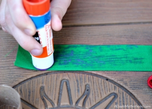 Glue the ribbon for your DIY Holiday Napkin Rings