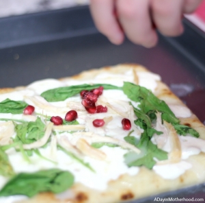 Just put the POM POM on top of this Rotisserie Chicken Arugula Pomegranate Pizza Recipe