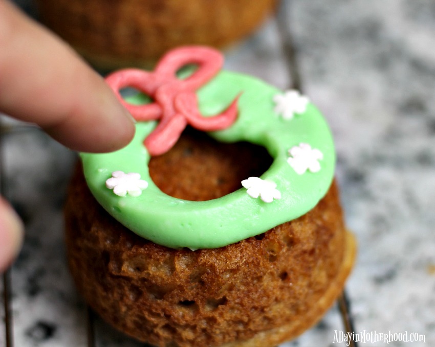 Add the sprinkles of your choice to the Holiday Wreath Spice Bundt Cake with Cream Cheese Icing Recipe