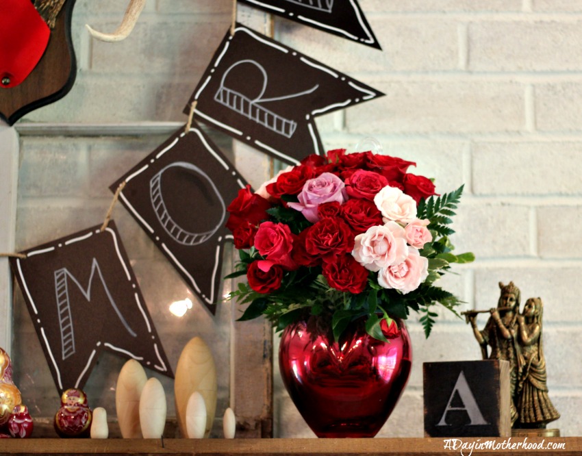 The Easy DIY Valentine Mantle Sign is highlighted by flowers from FTD