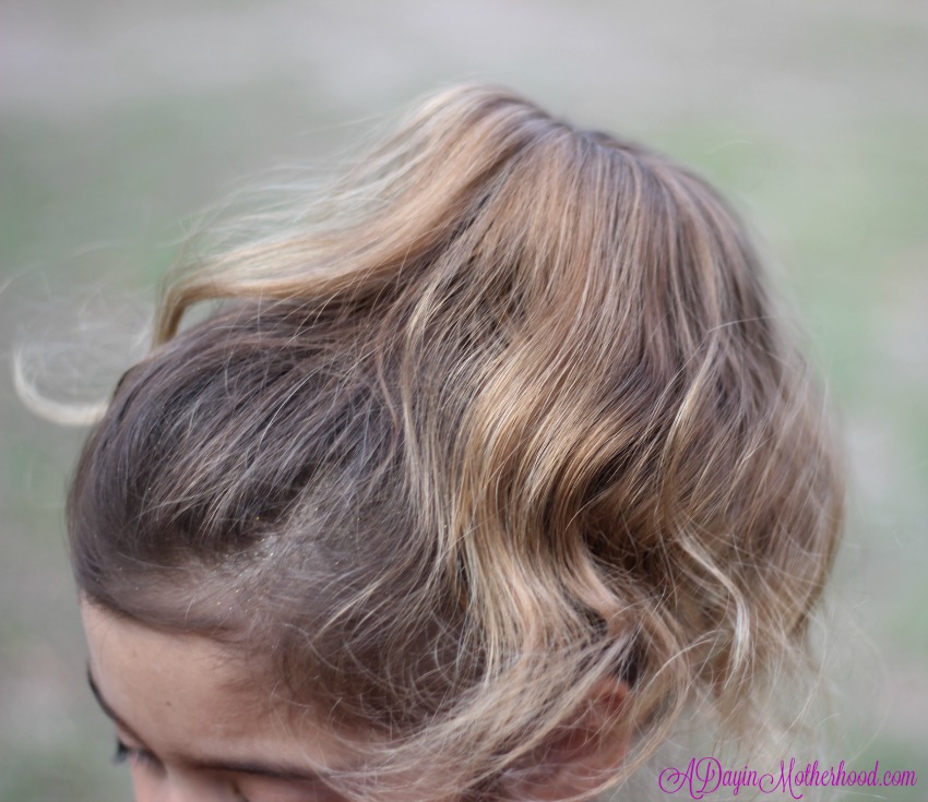 Comb the hair over for the Easy Princess Updo for Kids