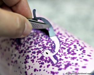 Use tweezers to remove the stickers on the DIY Personalized Insulated Tea Tumbler